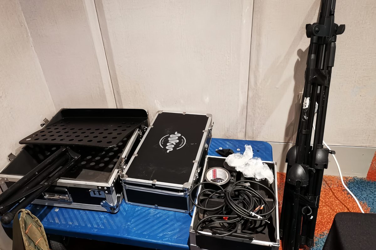 Flight cases, cabling and folded stands packed on a trolley