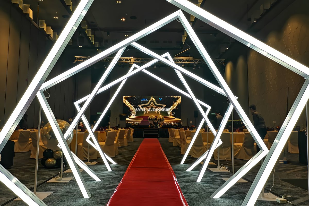 Illuminated square LED arch entrance over a red carpet