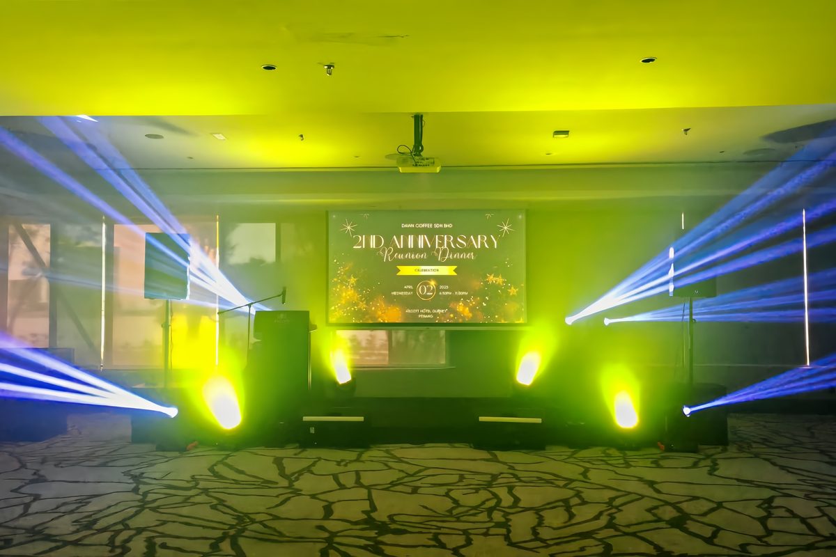 Blue and amber beams on a corporate anniversary stage