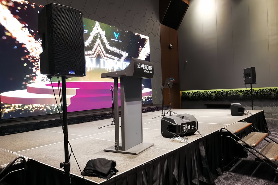 LED screen and podium built on stage before doors open