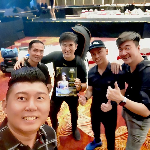Crew group photo backstage after a show