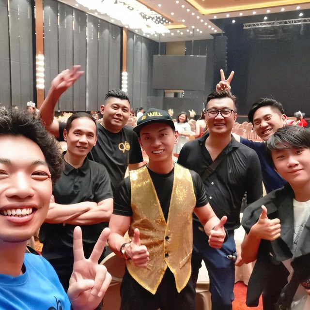 Crew smiling together at a table event