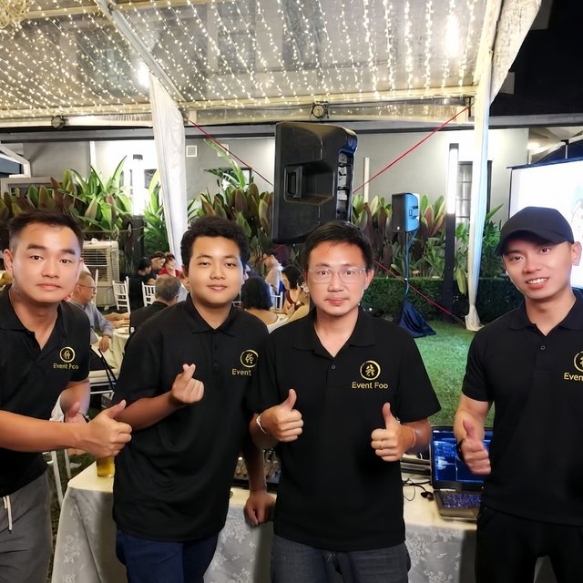 Four crew in Event Foo polos at an outdoor event