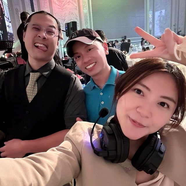 Three crew with headsets mid-event