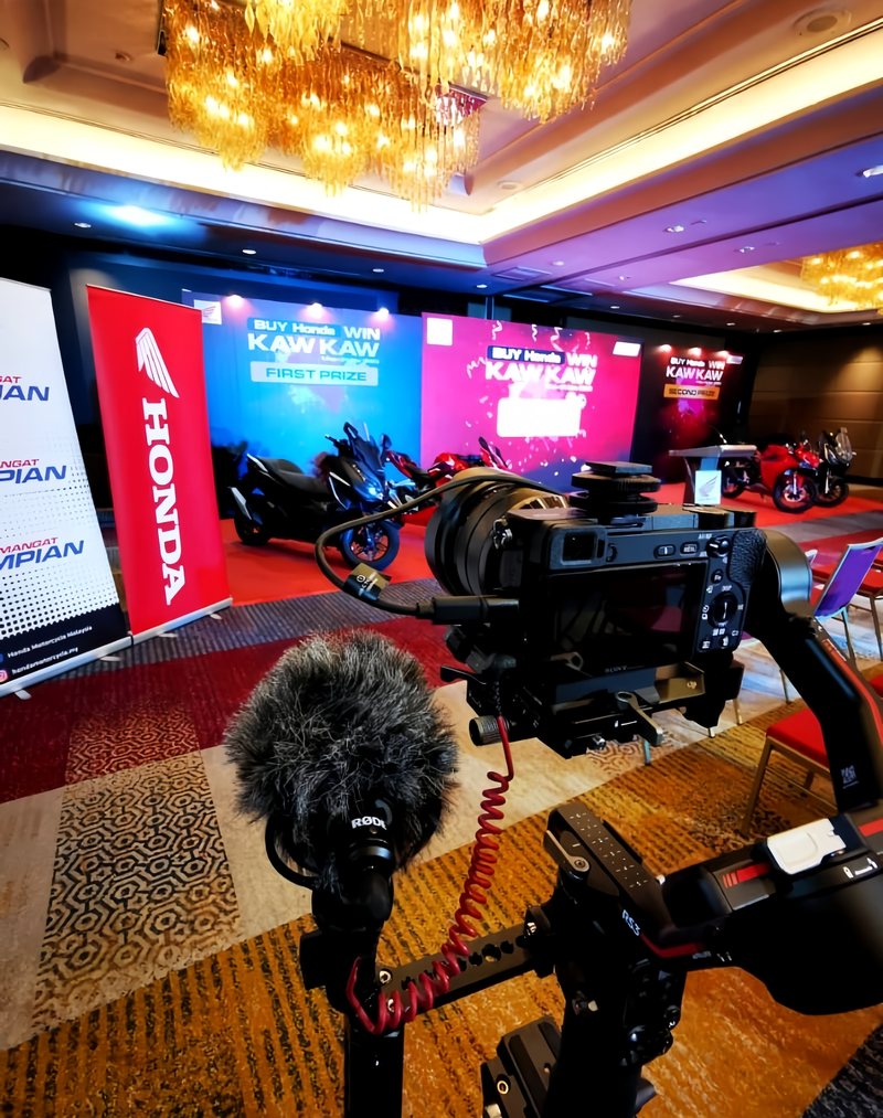 Cinema camera rig on a gimbal covering a corporate launch event