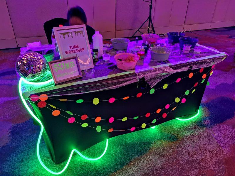 Slime workshop table glowing under UV light