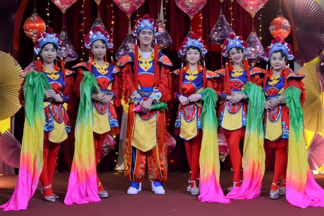 Rainbow silk-sleeve routine on stage