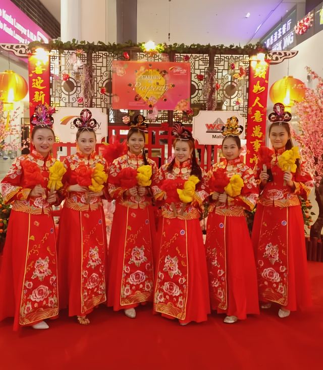 Red qipao group at a New Year event