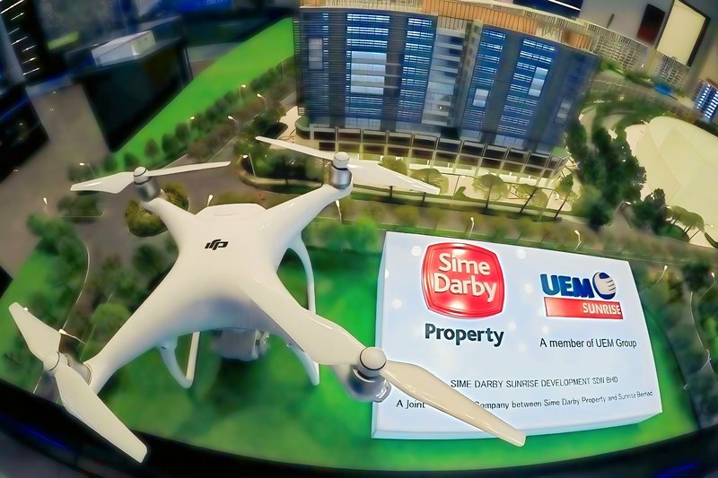 Drone filming a property developer's architectural scale model