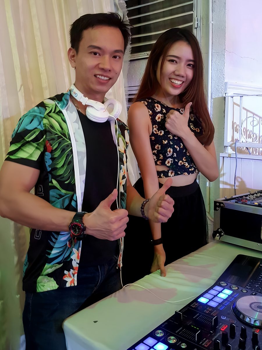 Two hosts at the controller, thumbs up before doors open