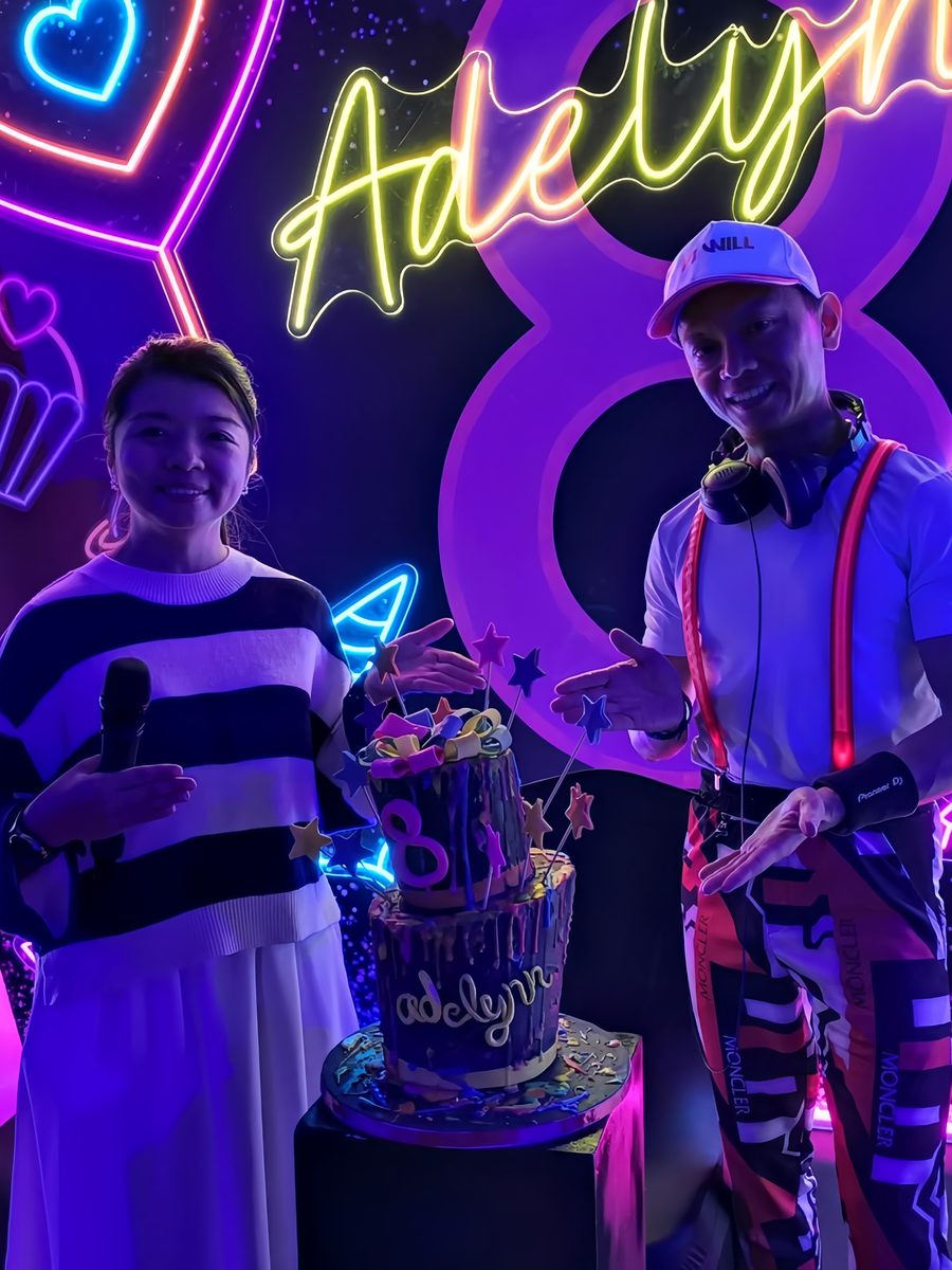 Emcee hosting a neon-lit birthday party