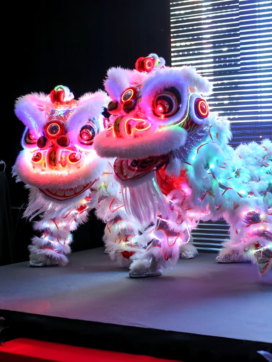 LED lion dance glowing on stage