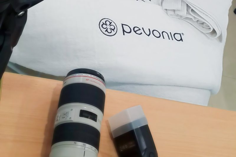 Camera bodies, telephoto lens and flash set up for a product shoot