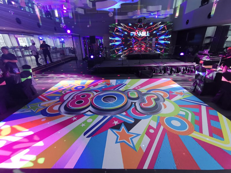Themed dance floor and LED wall at a private party