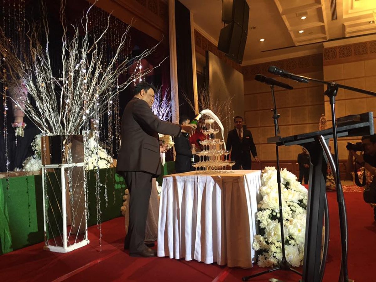 Champagne tower poured at the reception